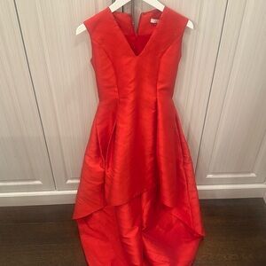 Alexis high low red sleeveless dress. Size small. Beautiful design in fabric.